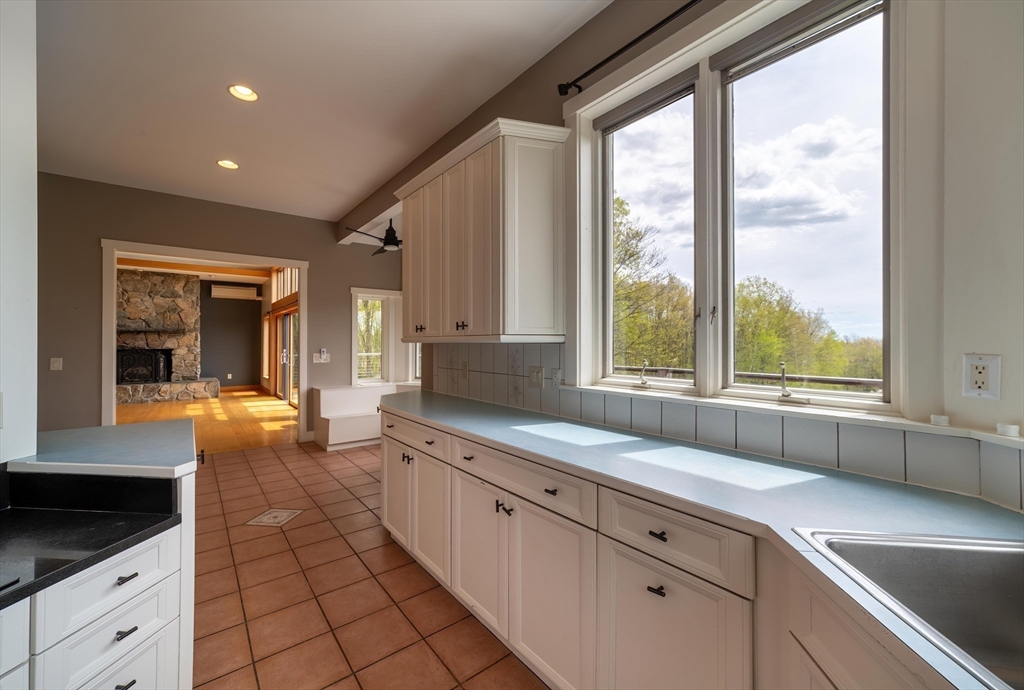 184 W Road Bernardston, MA 01337 - Photo 15 of 41 a large white kitchen with a large window