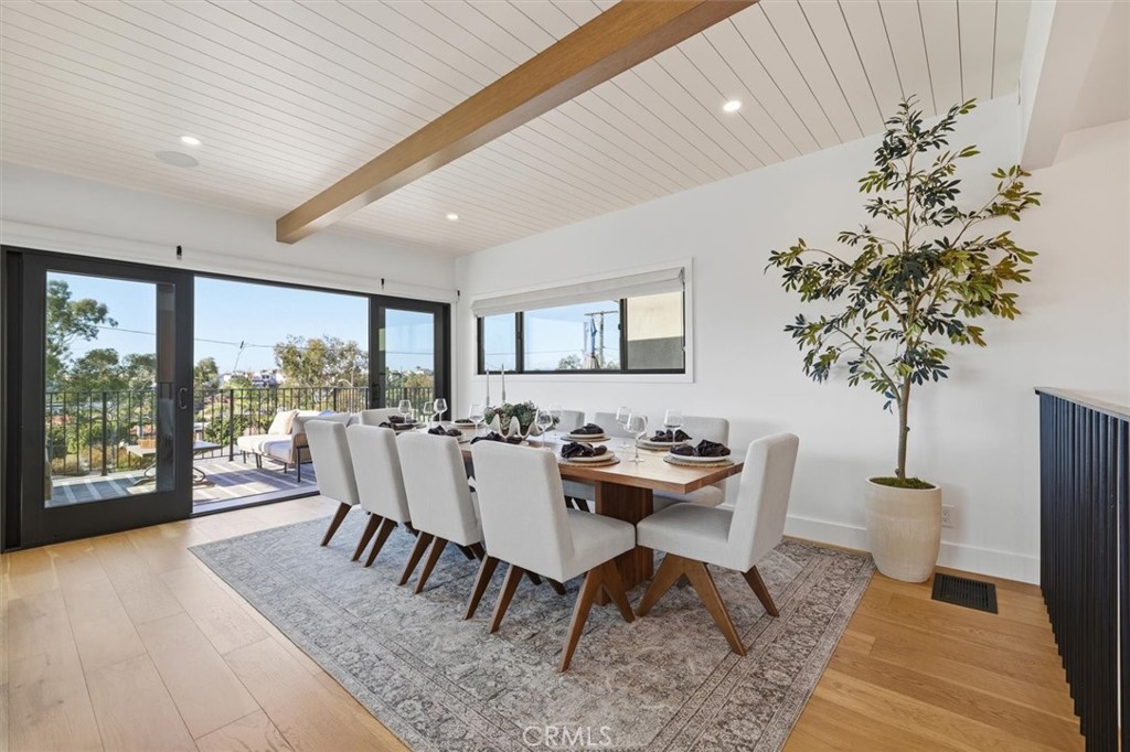 1909 Springfield Avenue Hermosa Beach, CA 90254 - Photo 12 of 31 a view of a dining room with furniture window and wooden floor