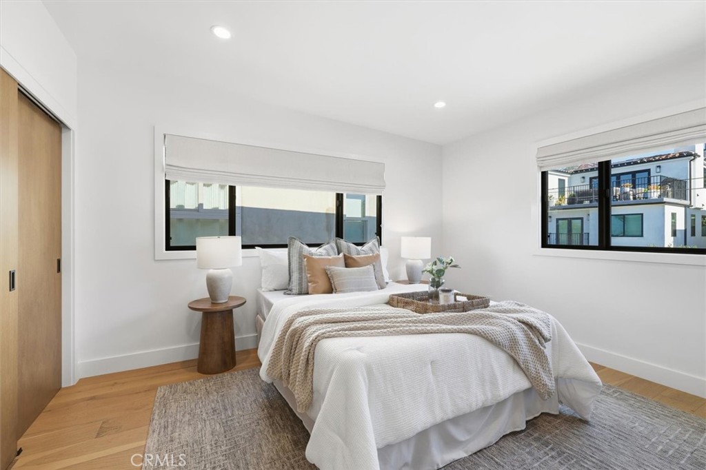 1909 Springfield Avenue Hermosa Beach, CA 90254 - Photo 14 of 31 a bedroom with a large bed and a window