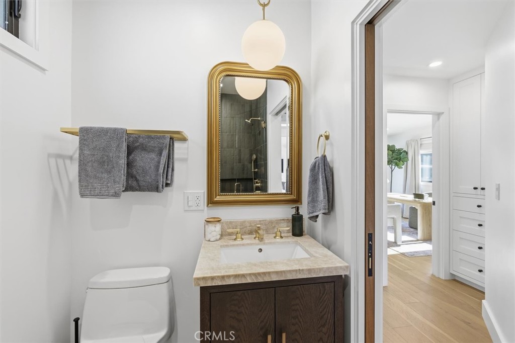 1909 Springfield Avenue Hermosa Beach, CA 90254 - Photo 16 of 31 a bathroom with a sink a toilet and mirror