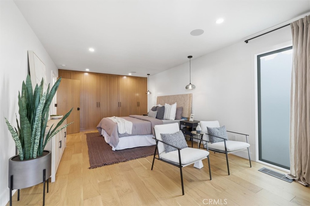 1909 Springfield Avenue Hermosa Beach, CA 90254 - Photo 22 of 31 a living room with furniture and a potted plant