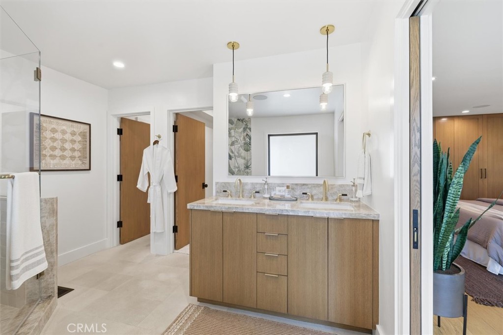 1909 Springfield Avenue Hermosa Beach, CA 90254 - Photo 24 of 31 a bathroom with a double vanity sink and a mirror