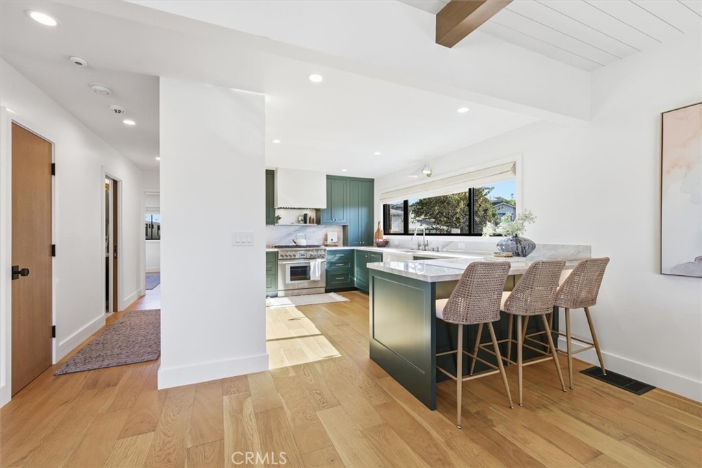 1909 Springfield Avenue Hermosa Beach, CA 90254 - Photo 8 of 31 a view of a dining room with furniture and wooden floor