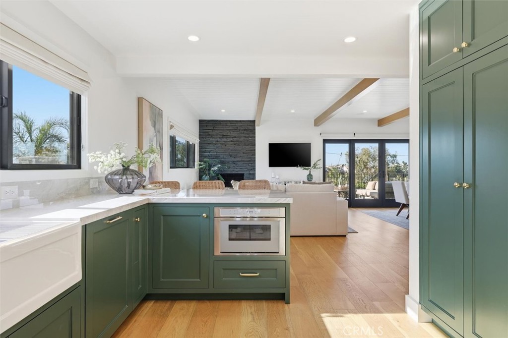 1909 Springfield Avenue Hermosa Beach, CA 90254 - Photo 10 of 31 a kitchen with kitchen island stainless steel appliances a sink stove and cabinets