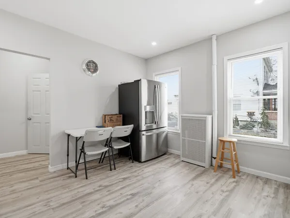 a kitchen with a table and chairs