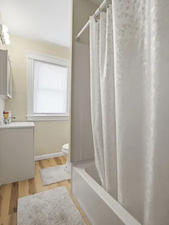 a bathroom with a sink and cabinets