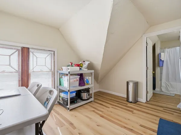 a kitchen with a refrigerator and a sink