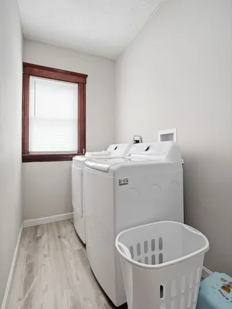 a bathroom with a shower a mirror and a sink