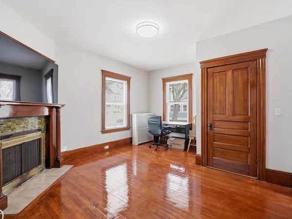 a view of a livingroom with furniture and a workspace