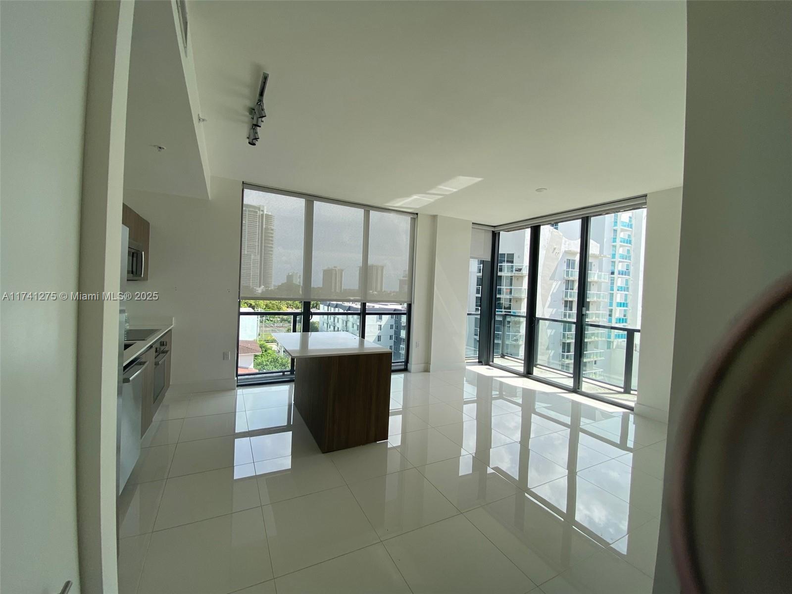 201 Southwest 17th Road, Unit 806 Miami, FL 33129 - Photo 2 of 10 a view of a room with windows