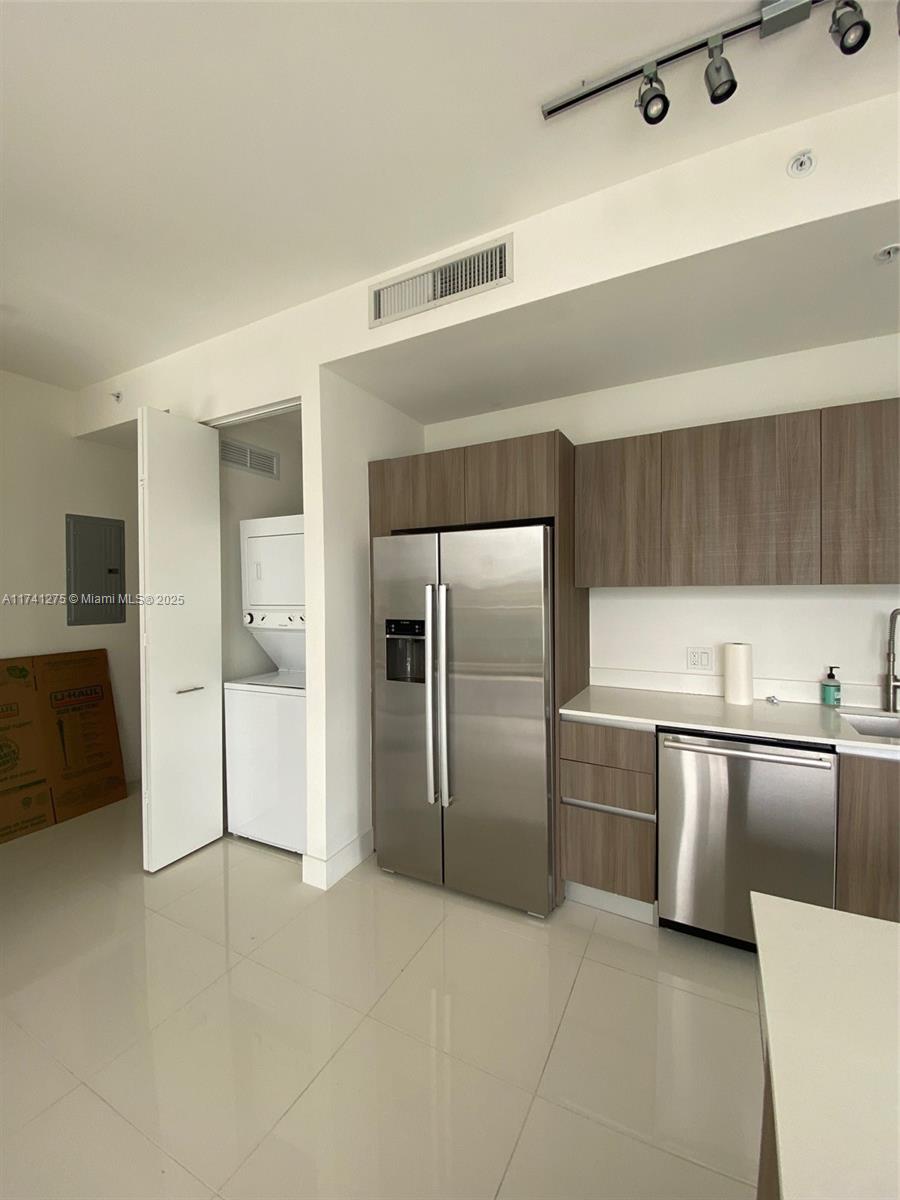 201 Southwest 17th Road, Unit 806 Miami, FL 33129 - Photo 6 of 10 a kitchen with stainless steel appliances a refrigerator and a sink
