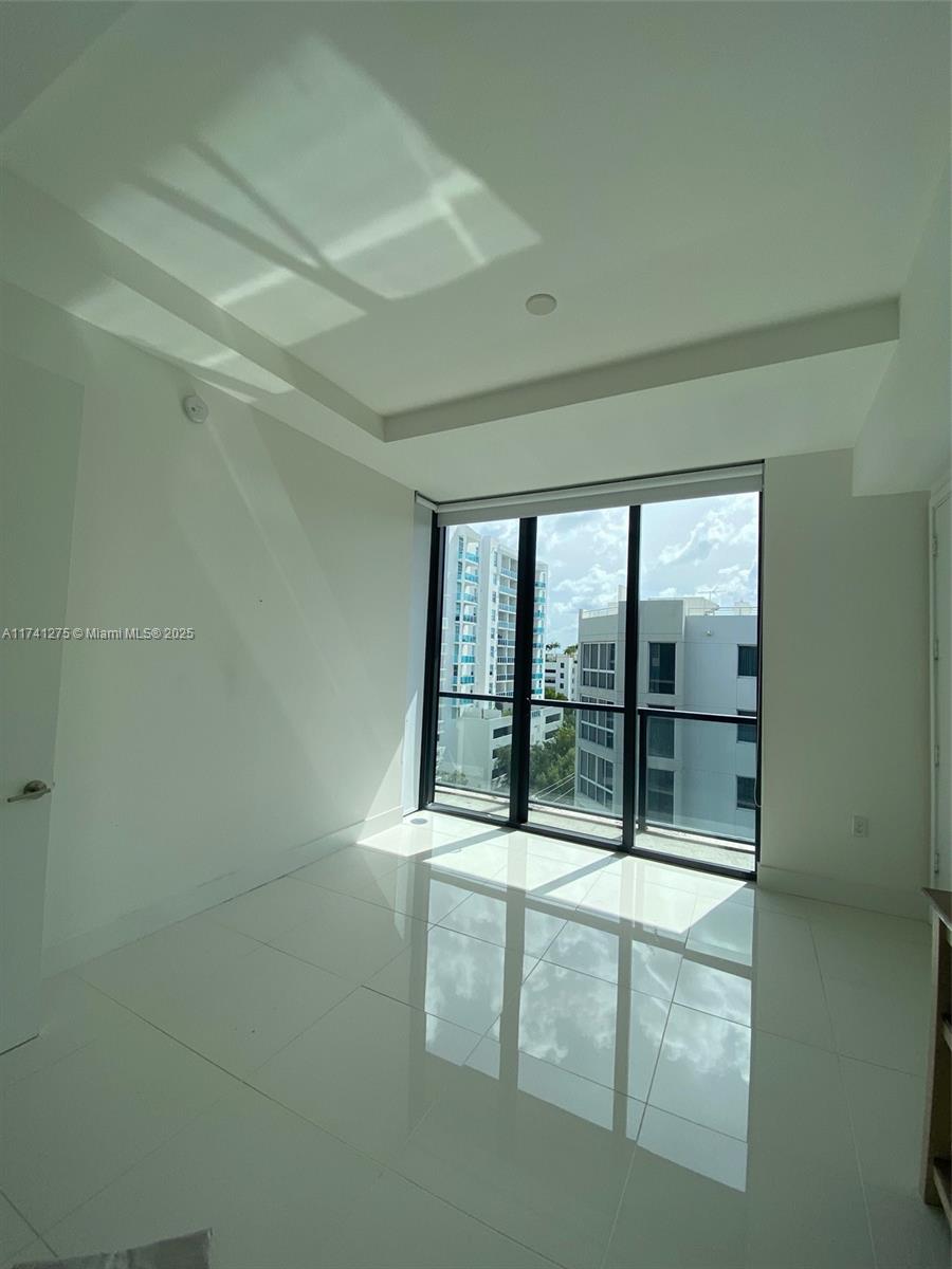 201 Southwest 17th Road, Unit 806 Miami, FL 33129 - Photo 8 of 10 view of an empty room with a balcony