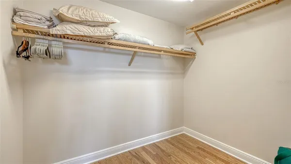 a living room with furniture and a kitchen