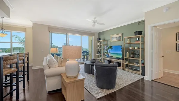 a view of a balcony with two chairs and a potted plant on a table