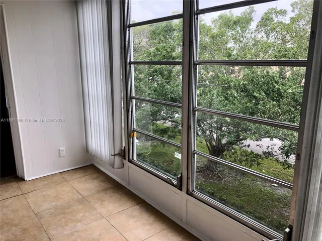 a view of a glass door and a window