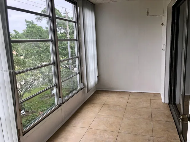 a view of an empty room and window