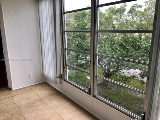 a view of a glass door and a window