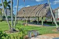 a backyard of apartments with large trees