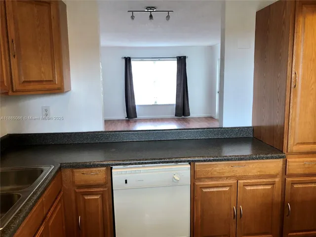 a view of cabinets and window