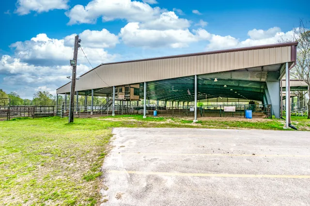 a view of a house with swimming pool and porch
