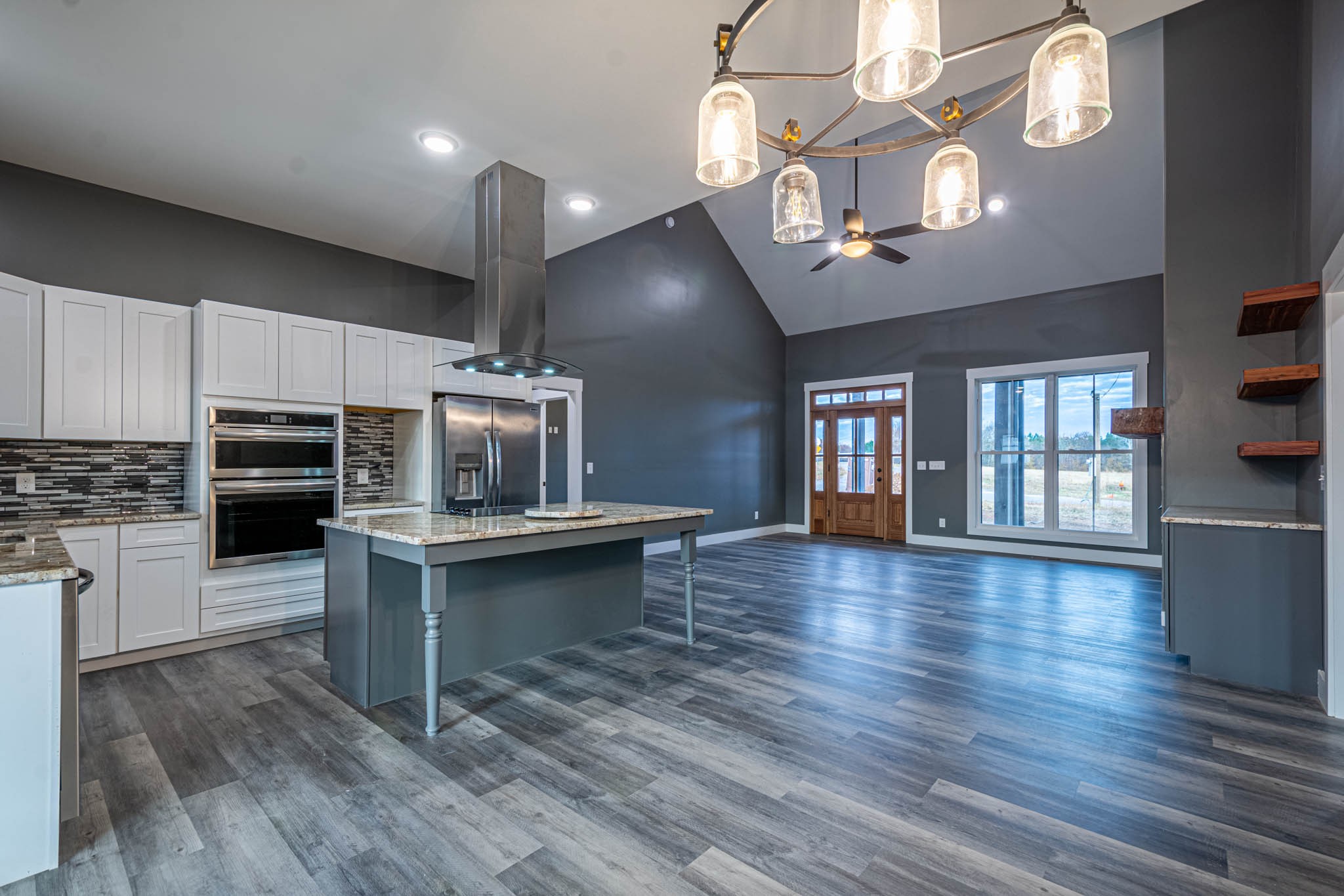476 Chestnut Grove Road Pulaski, TN 38478 - Photo 16 of 55 a open kitchen with cabinets a stove and a wooden floor