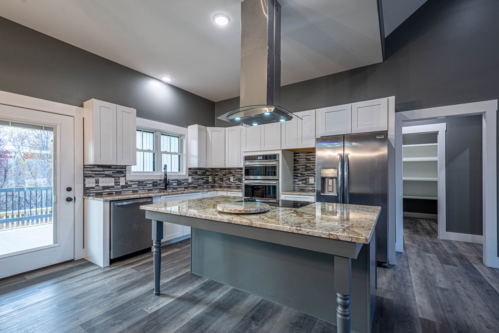 476 Chestnut Grove Road Pulaski, TN 38478 - Photo 18 of 55 a kitchen with kitchen island granite countertop a sink cabinets and stainless steel appliances