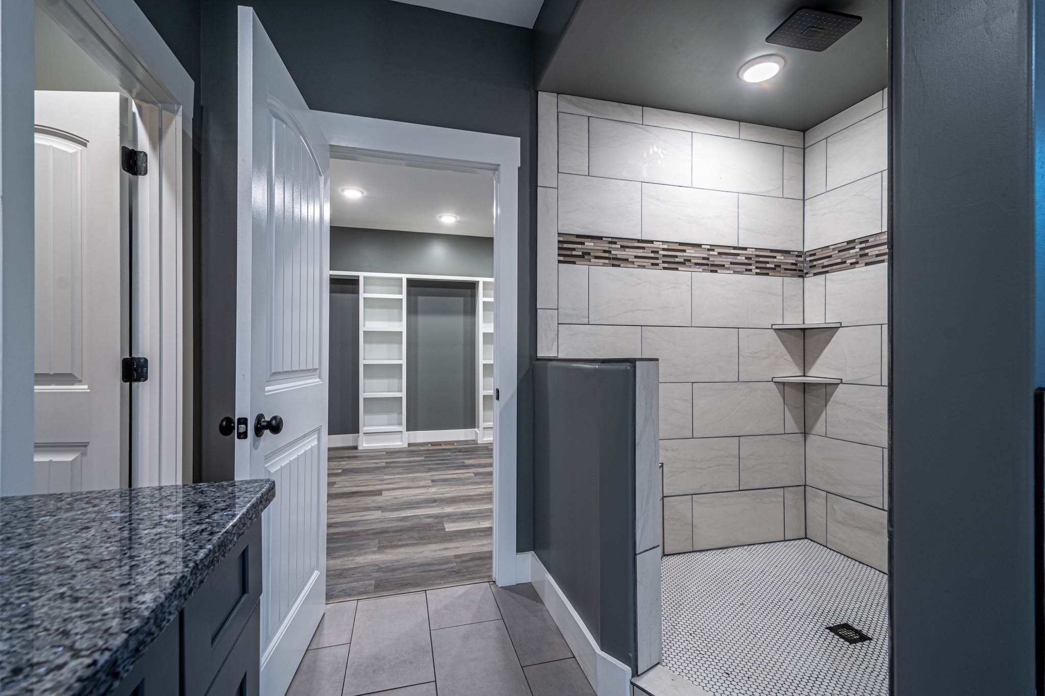 476 Chestnut Grove Road Pulaski, TN 38478 - Photo 33 of 55 a bathroom with a granite countertop shower a mirror and a sink