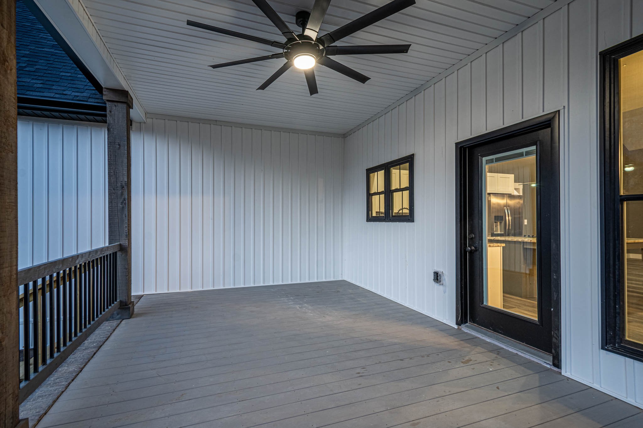 476 Chestnut Grove Road Pulaski, TN 38478 - Photo 51 of 55 an empty room with wooden floor chandelier fan and windows