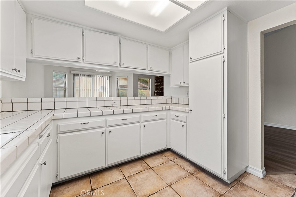 43610 16th Street East Lancaster, CA 93535 - Photo 8 of 21 a kitchen with white cabinets and white appliances