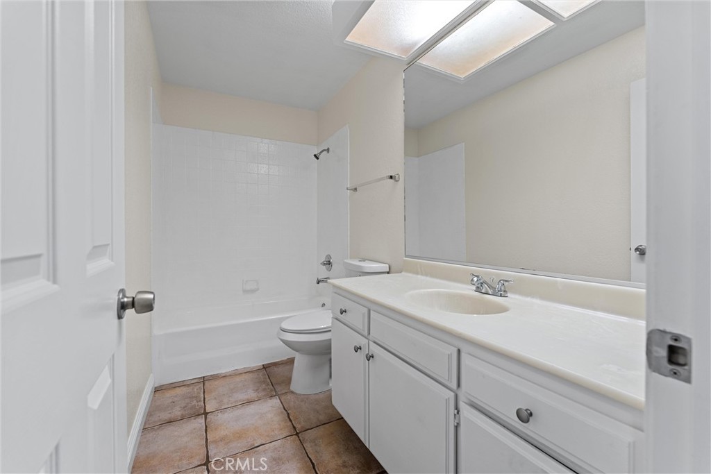 43610 16th Street East Lancaster, CA 93535 - Photo 10 of 21 a bathroom with a sink a toilet and shower