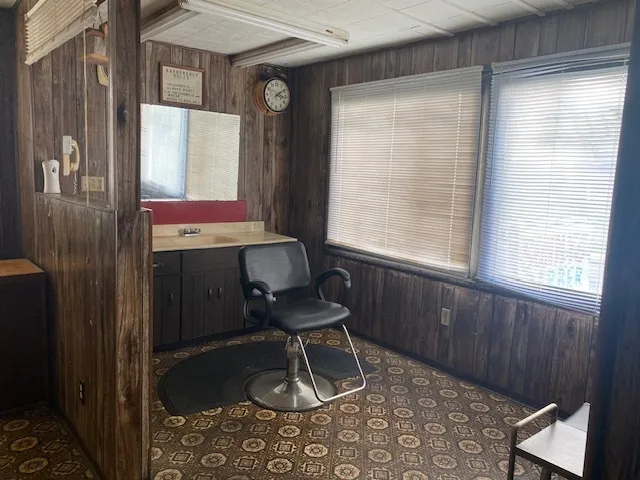 a room that has a window and a chair in it