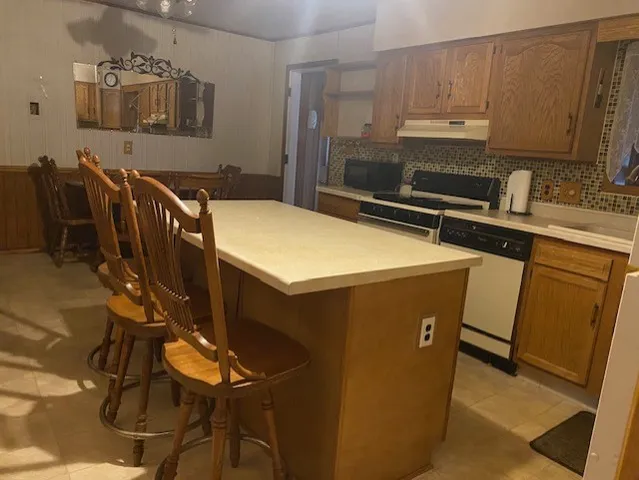 a kitchen with cabinets a sink and appliances