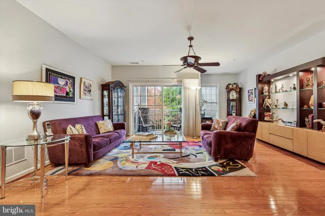 a living room with furniture rug and window