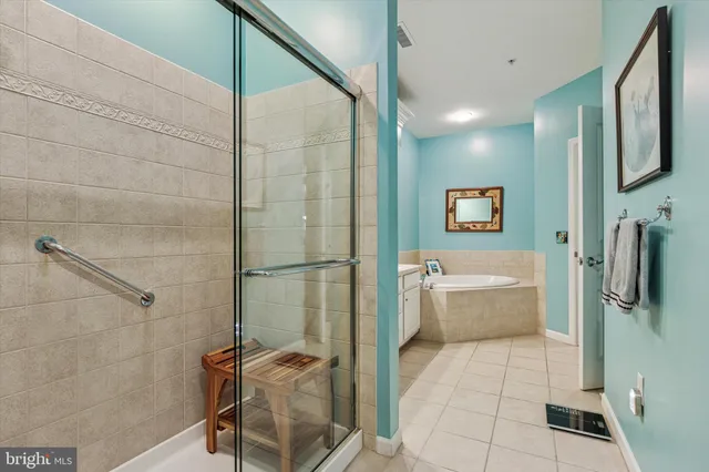 a bathroom with a tub and a shower