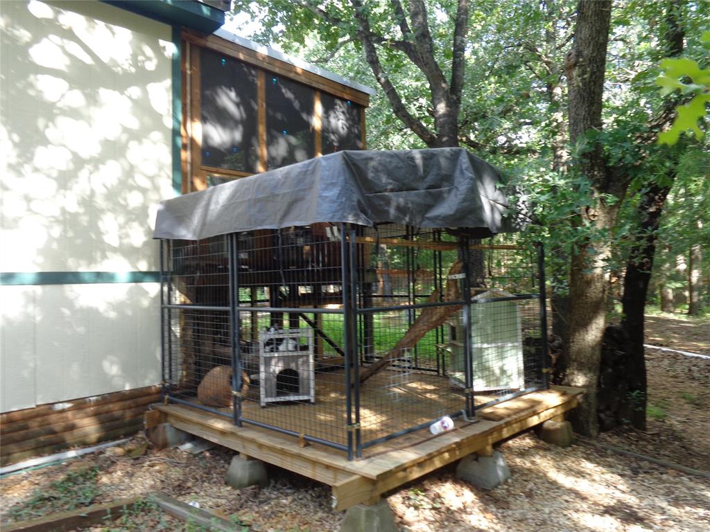 5525 Cedar Oaks Road Grandview, TX 76050 - Photo 26 of 40 Cat patio or could be used as a 4th patio, deck, or bird aviary