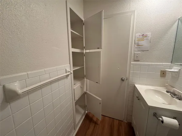 a bathroom with a sink and mirror