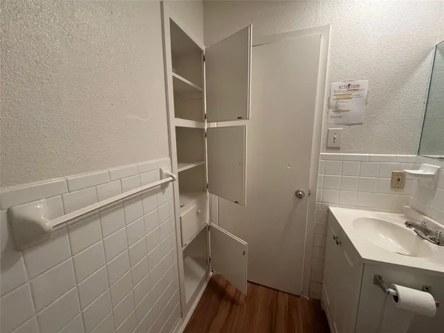 a bathroom with a sink and mirror