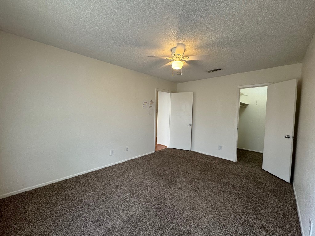 4810 West Wind Trail, Unit 104 Austin, TX 78745 - Photo 16 of 21 an empty room with a view of a house