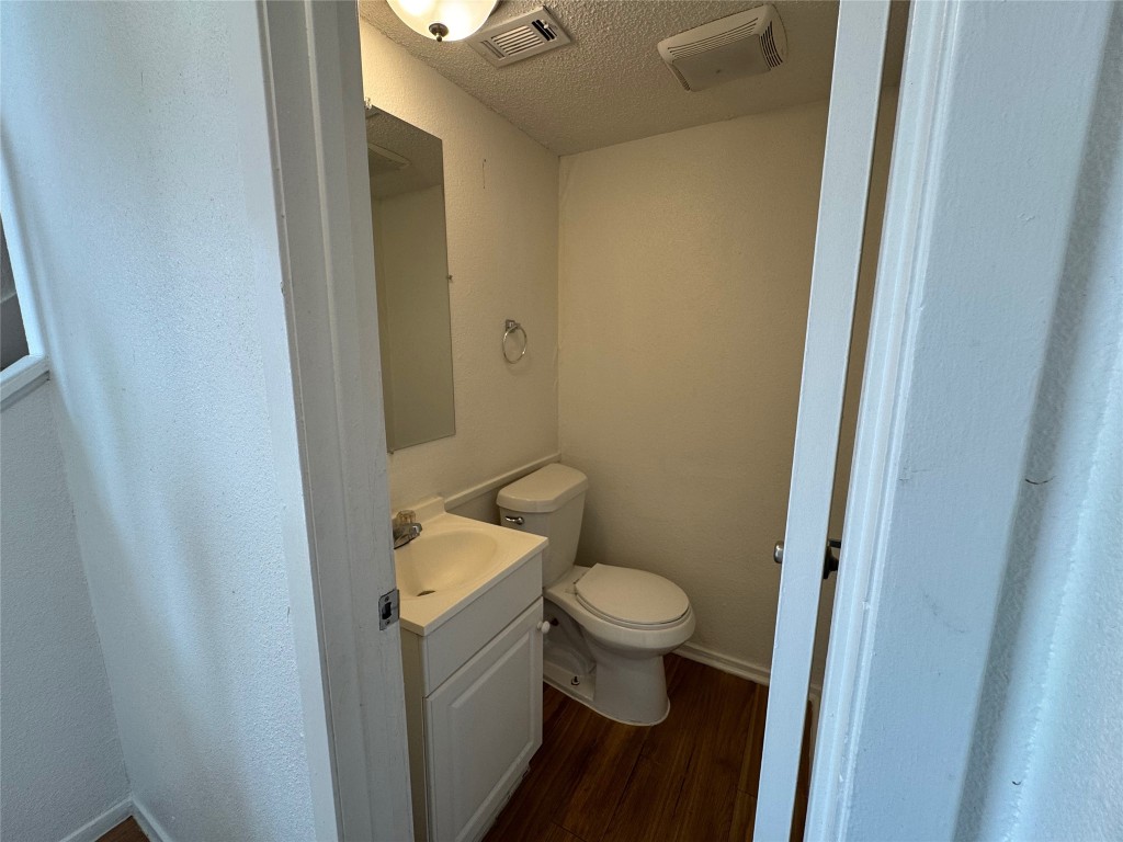 4810 West Wind Trail, Unit 104 Austin, TX 78745 - Photo 9 of 21 a bathroom with a sink and a toilet