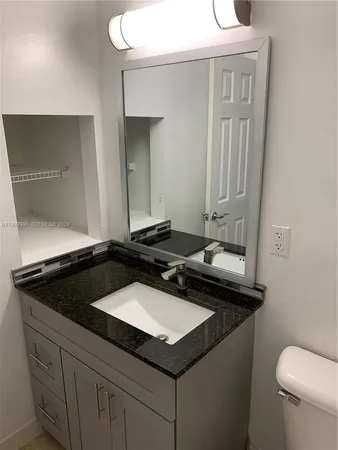 a bathroom with a sink and a toilet