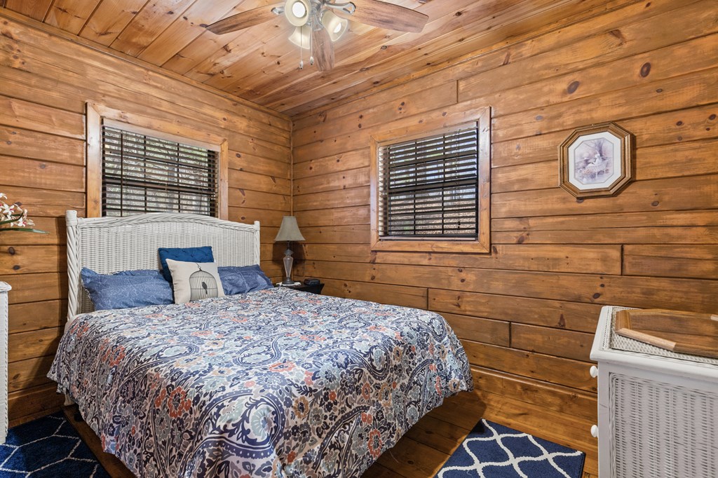 267 Granny Branch Drive Blue Ridge, GA 30513 - Photo 14 of 30 a bedroom with a bed and a window