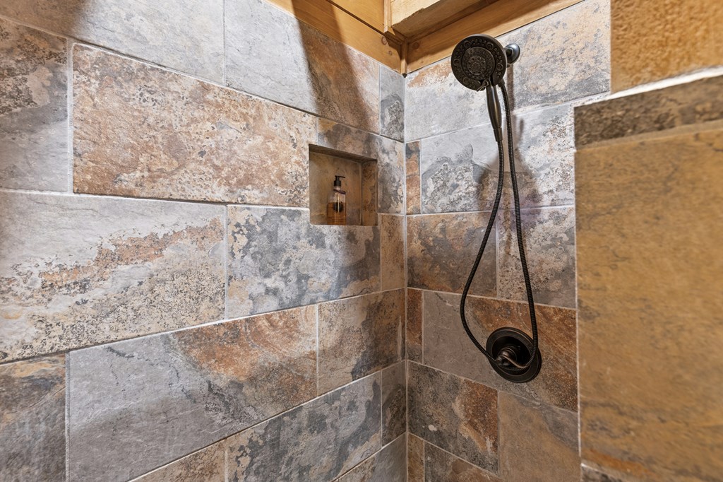267 Granny Branch Drive Blue Ridge, GA 30513 - Photo 18 of 30 a bathroom with a shower