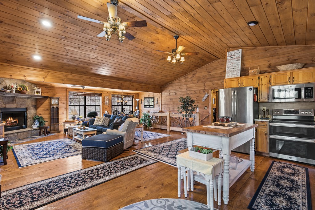 267 Granny Branch Drive Blue Ridge, GA 30513 - Photo 6 of 30 a living room with fireplace furniture and a rug