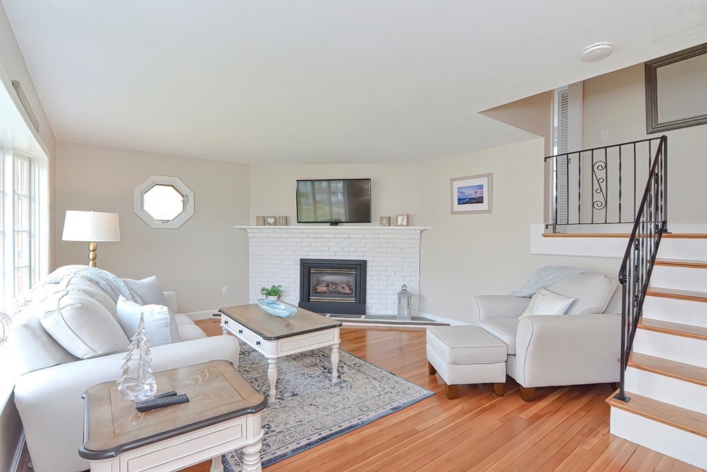 28 Tilden Road Scituate, MA 02066 - Photo 13 of 27 a living room with furniture and a fireplace