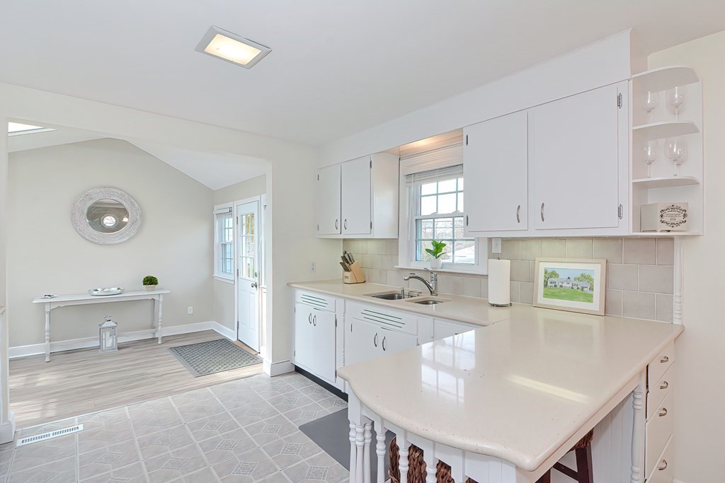 28 Tilden Road Scituate, MA 02066 - Photo 7 of 27 a kitchen with stainless steel appliances granite countertop a sink and cabinets