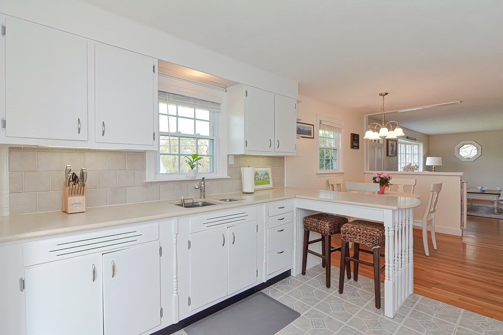 28 Tilden Road Scituate, MA 02066 - Photo 8 of 27 a kitchen with white cabinets and sink