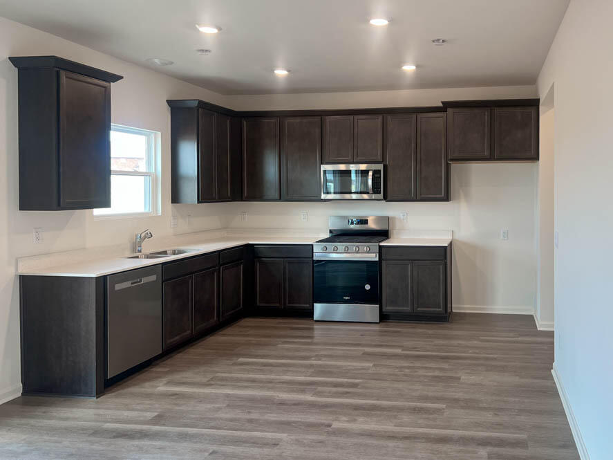 7174 Fair Oaks Road Mount Pleasant, WI 53403 - Photo 3 of 26 Kitchen with 42 inch cabinets and white quartz countertops