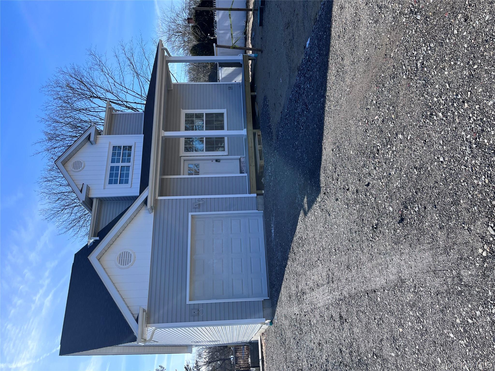 Lot 1 Westfield Road Coram, NY 11727 - Photo 2 of 4 a front view of a house with a yard