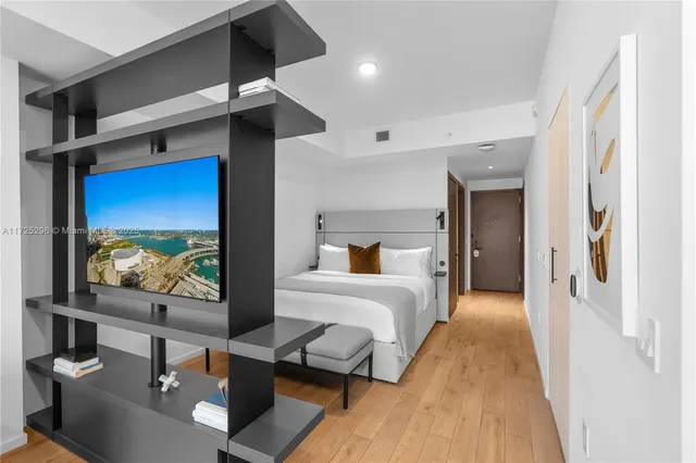 a bedroom with a bed and a table