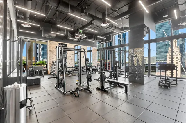 a lobby with furniture and floor to ceiling window